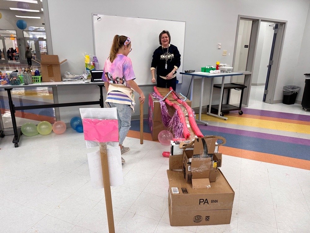 Students at cardboard arcade